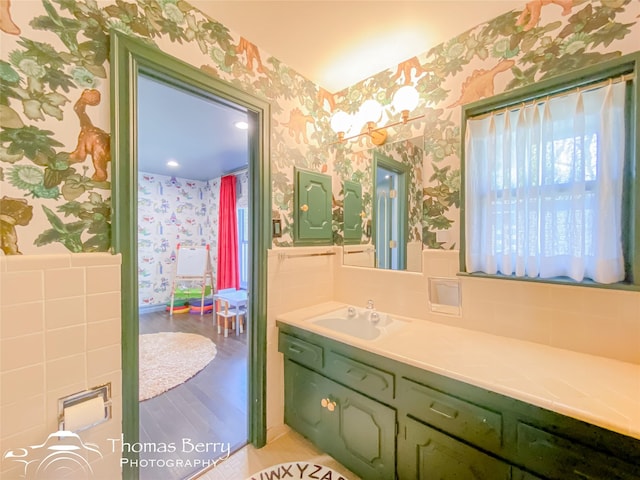 bathroom featuring hardwood / wood-style floors and vanity