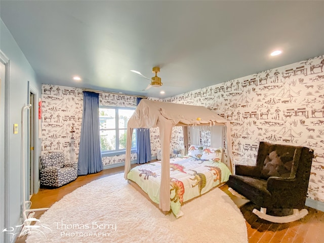 bedroom featuring ceiling fan and wood-type flooring