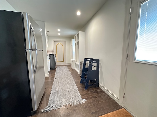 hallway with dark hardwood / wood-style floors