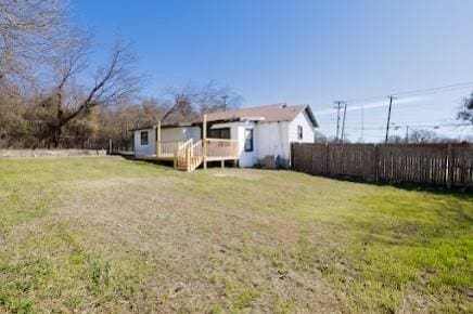 view of yard featuring a wooden deck