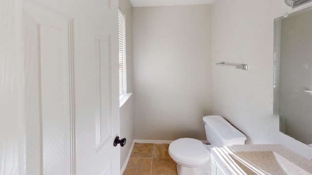 bathroom with tile patterned floors and toilet