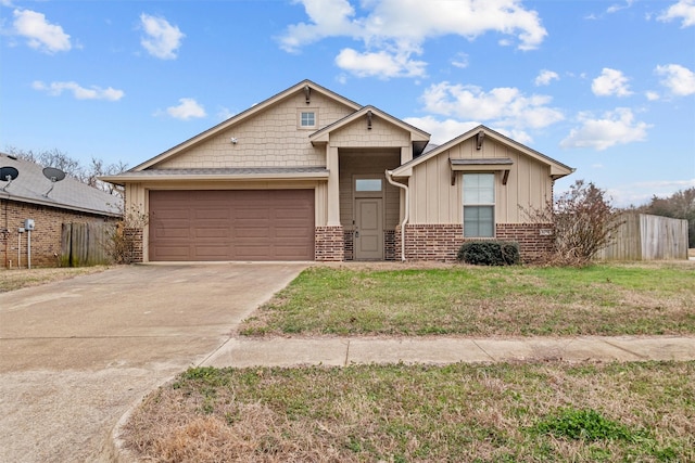 view of front of property with driveway, brick siding, a front yard, and fence