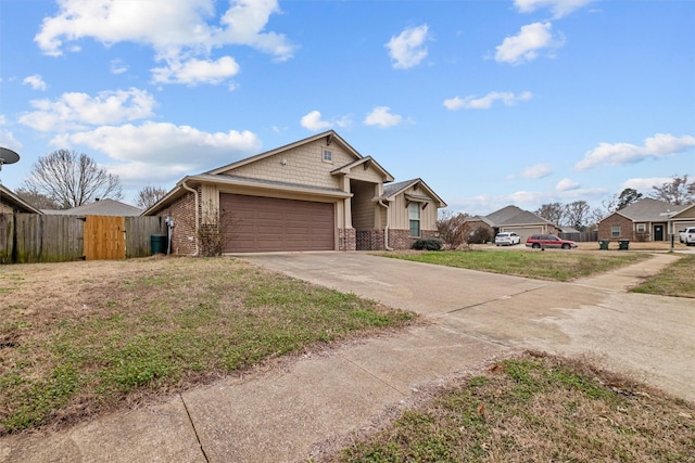 view of front facade featuring brick siding, concrete driveway, an attached garage, fence, and a residential view