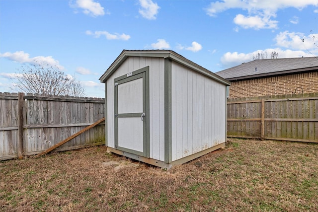 view of shed with a fenced backyard