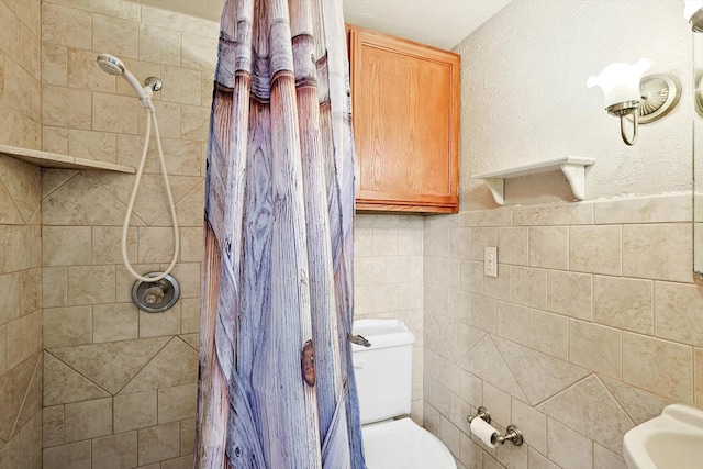 bathroom with toilet and walk in shower