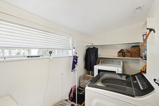 laundry room featuring washing machine and dryer