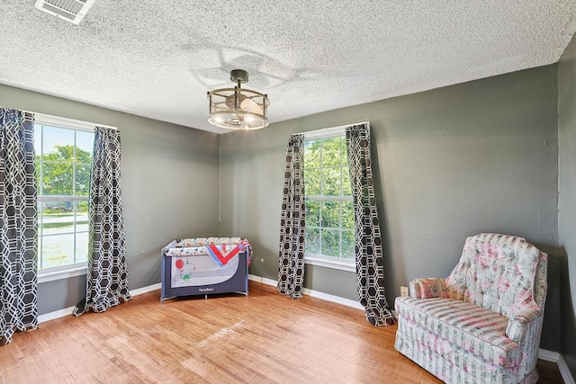 living area with wood-type flooring