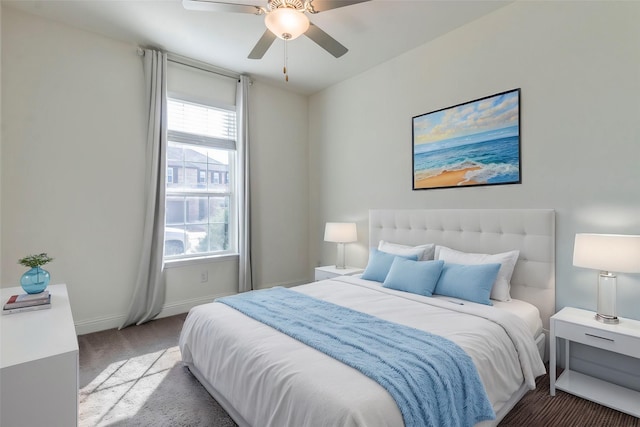 bedroom with ceiling fan, carpet flooring, and multiple windows