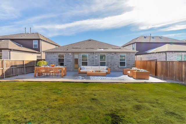 back of house featuring an outdoor hangout area, a yard, and a patio