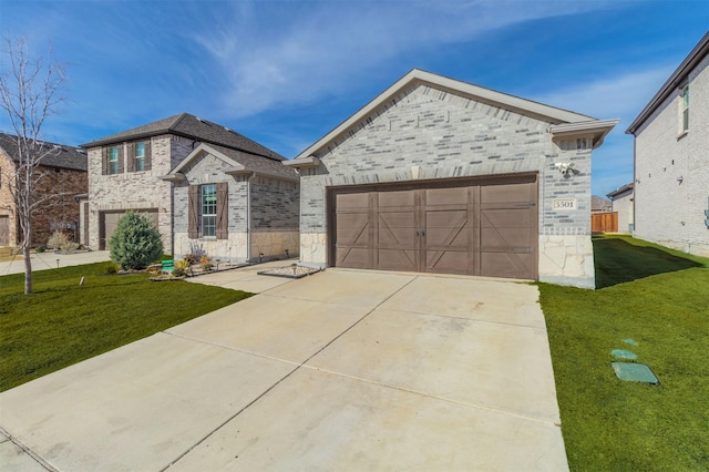 view of front of property featuring a garage and a front yard