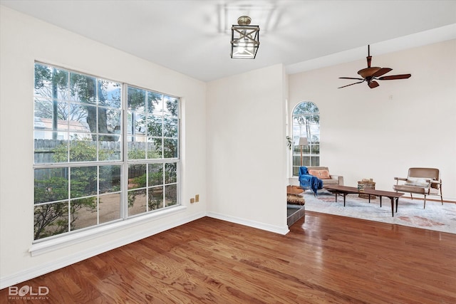 unfurnished dining area with ceiling fan and hardwood / wood-style floors