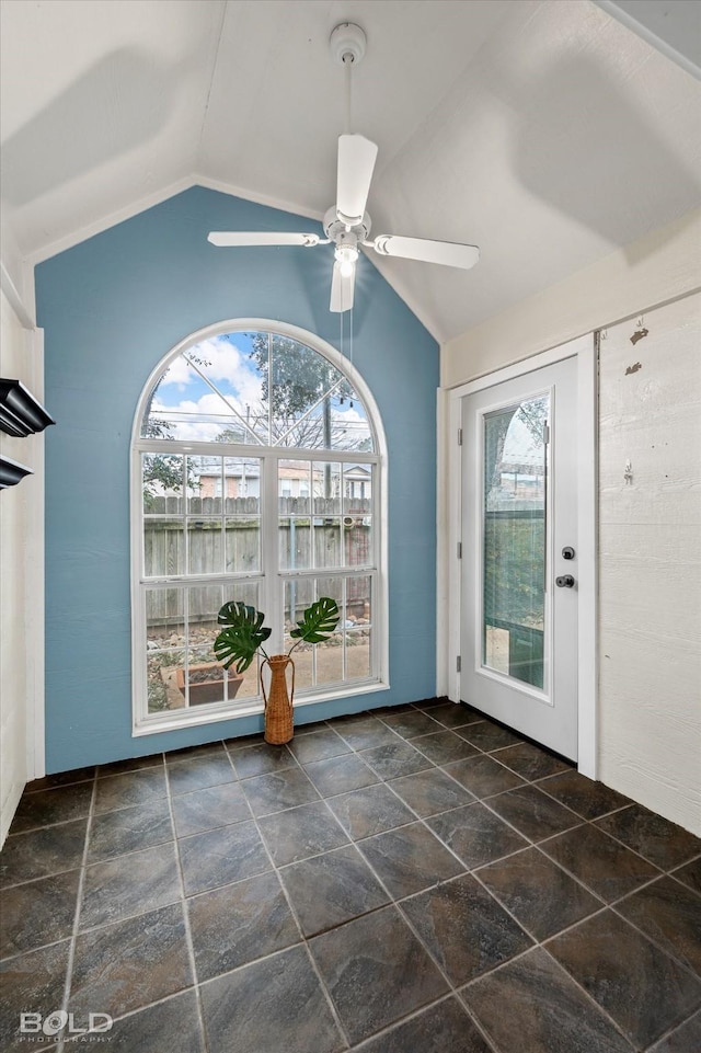 foyer with lofted ceiling, ceiling fan, a wealth of natural light, and french doors