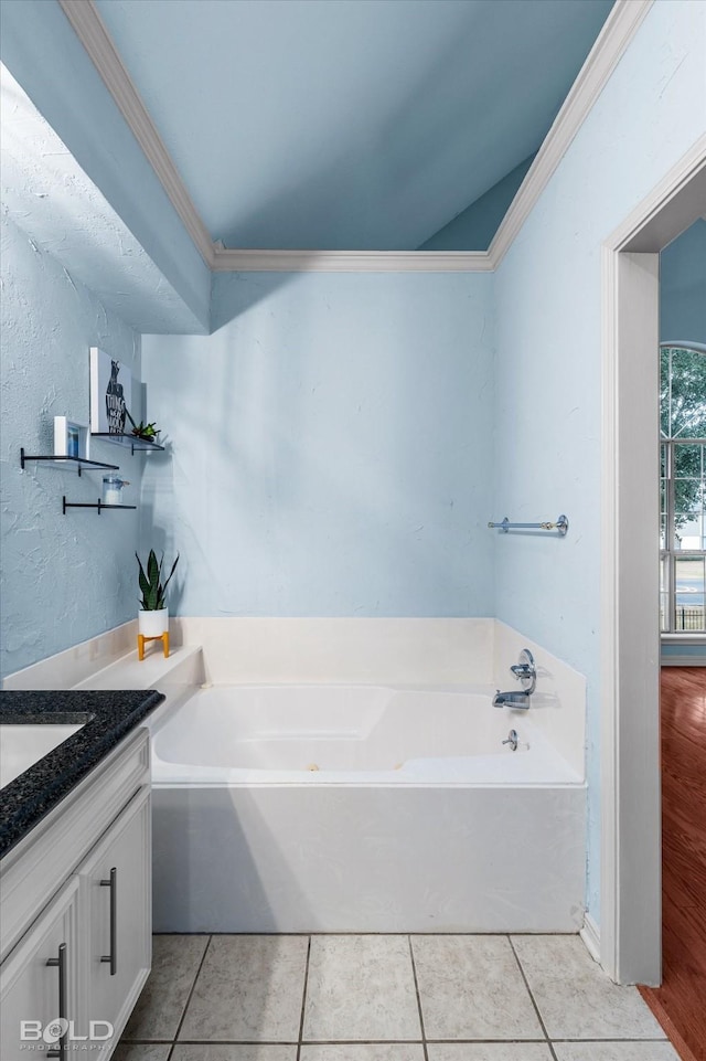 bathroom with vanity, tile patterned flooring, and a tub