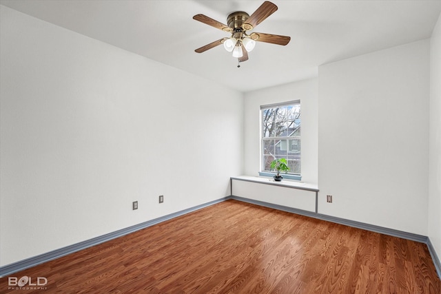 spare room with ceiling fan and hardwood / wood-style floors