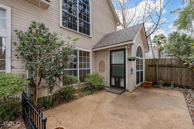 view of exterior entry featuring a patio area