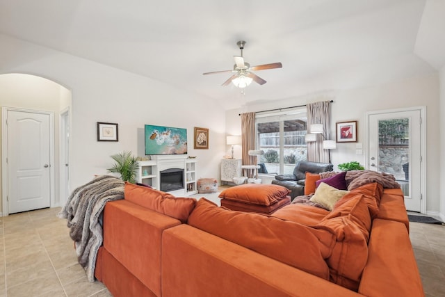 living room featuring ceiling fan and light tile patterned floors