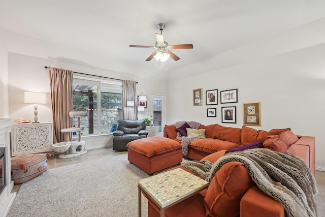 living room with ceiling fan and lofted ceiling