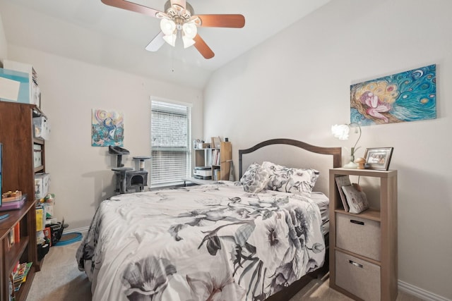 carpeted bedroom featuring ceiling fan and vaulted ceiling