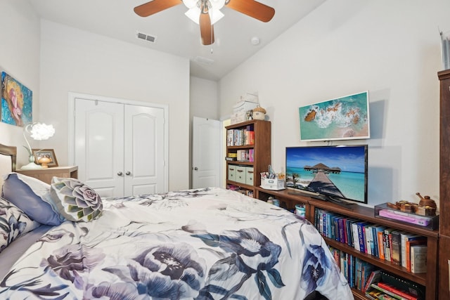 bedroom featuring vaulted ceiling, a closet, and ceiling fan