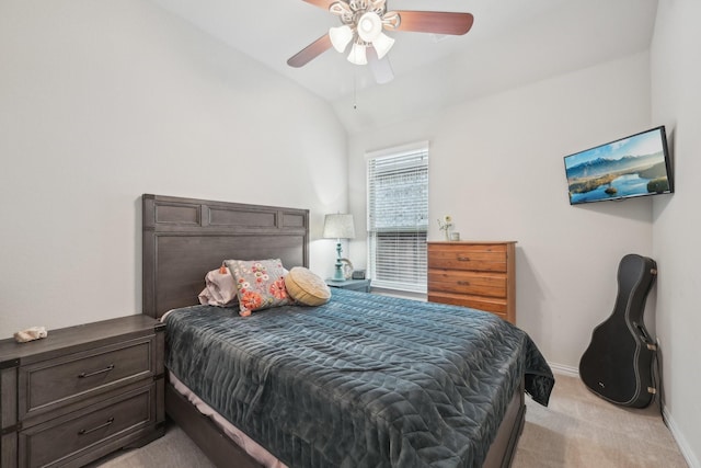 bedroom with ceiling fan, light carpet, and lofted ceiling