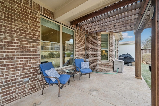 view of patio / terrace featuring grilling area and a pergola