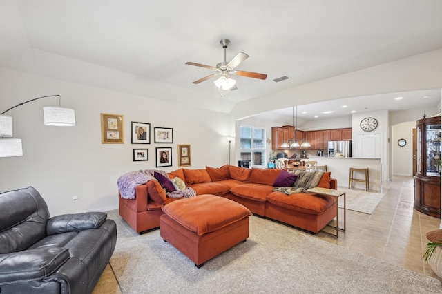 living room with ceiling fan and light tile patterned floors