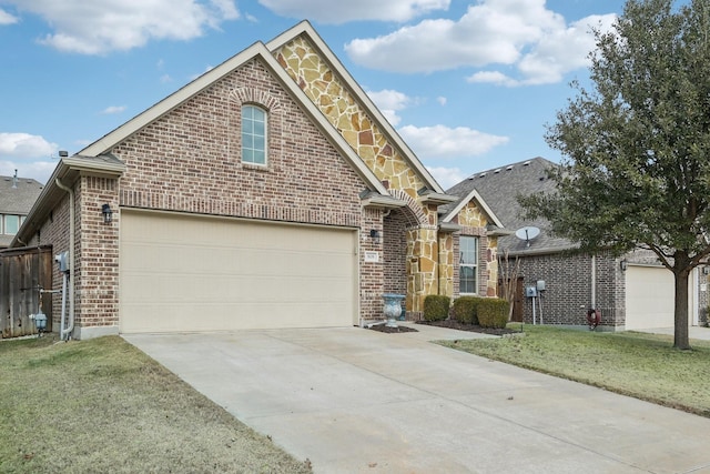 view of property featuring a garage and a front lawn