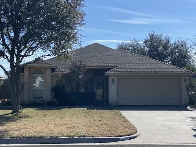 single story home featuring a garage