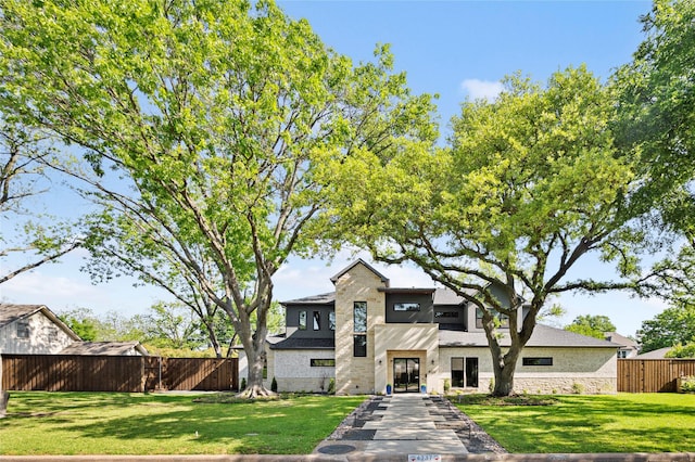 4737 Sugar Mill Rd, Dallas, TX 75244 - view of front facade with a front lawn, stone siding, and fence