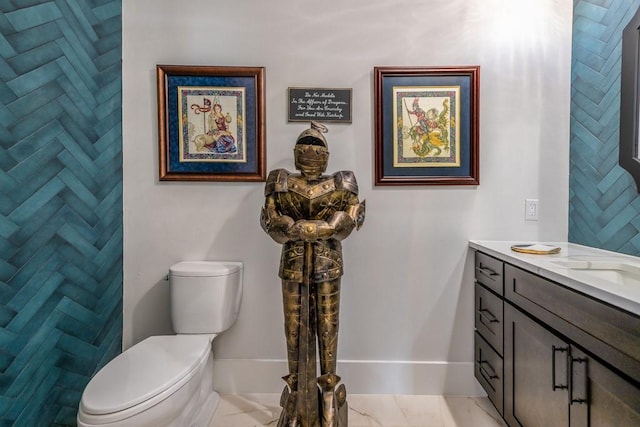 bathroom featuring toilet and vanity