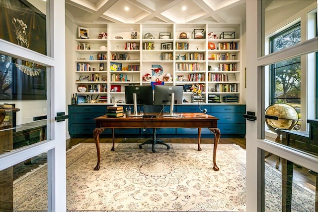 office with beam ceiling, built in features, coffered ceiling, and hardwood / wood-style flooring