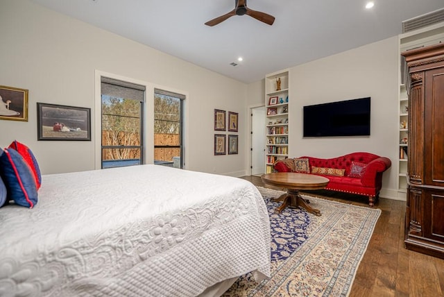 bedroom featuring ceiling fan, dark wood-type flooring, and access to exterior