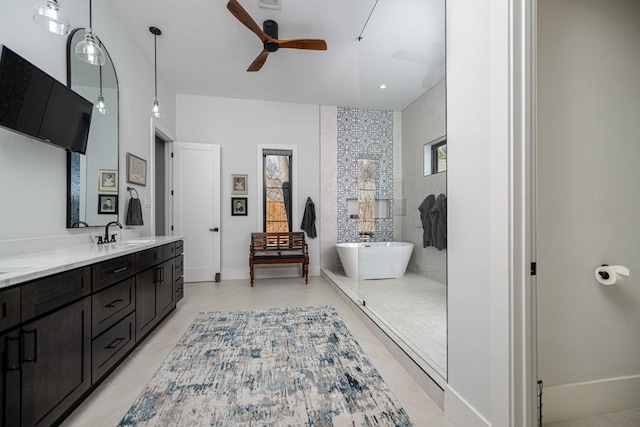 bathroom with ceiling fan, vanity, and plus walk in shower