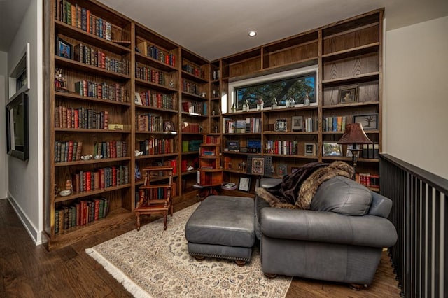 4737 Sugar Mill Rd, Dallas, TX 75244 - sitting room featuring wood finished floors and bookshelves