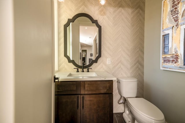 4737 Sugar Mill Rd, Dallas, TX 75244 - bathroom featuring wallpapered walls, toilet, and vanity