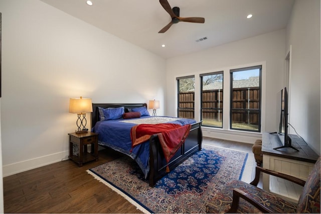 bedroom featuring ceiling fan and dark hardwood / wood-style flooring