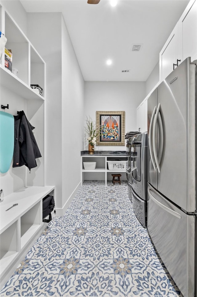 4737 Sugar Mill Rd, Dallas, TX 75244 - laundry area featuring cabinet space, washer and dryer, visible vents, and baseboards
