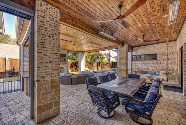 view of patio with ceiling fan and an outdoor living space