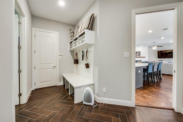 mudroom featuring dark parquet floors and ceiling fan