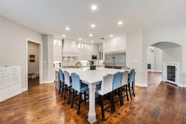 dining area with dark hardwood / wood-style floors