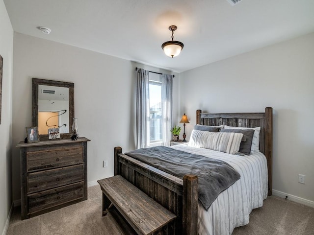 bedroom with carpet flooring and baseboards