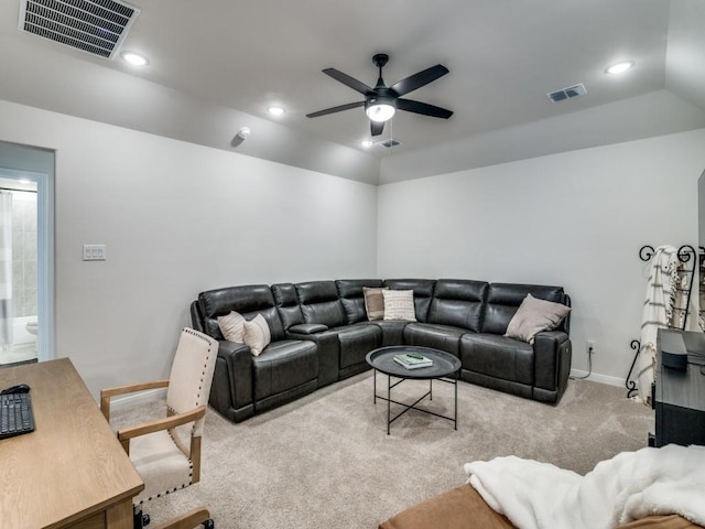 living room with ceiling fan, lofted ceiling, and light carpet