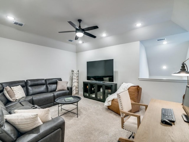 living room featuring light carpet, lofted ceiling, and ceiling fan