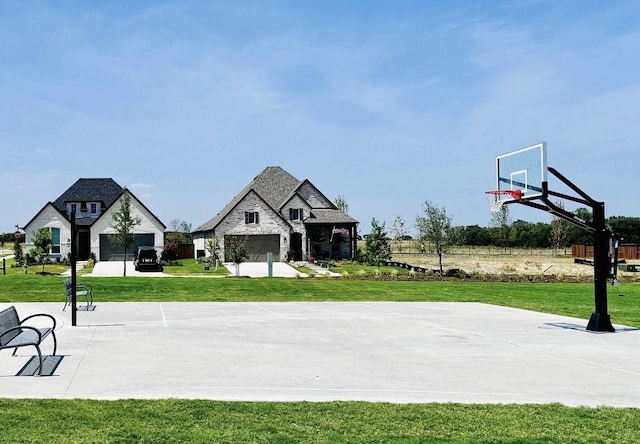 view of sport court featuring a yard