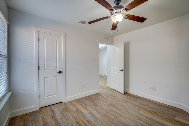 unfurnished bedroom featuring ceiling fan and light hardwood / wood-style floors