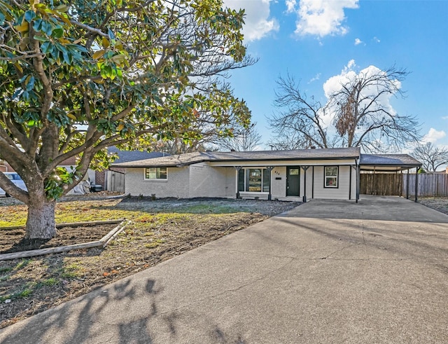 ranch-style house with a carport