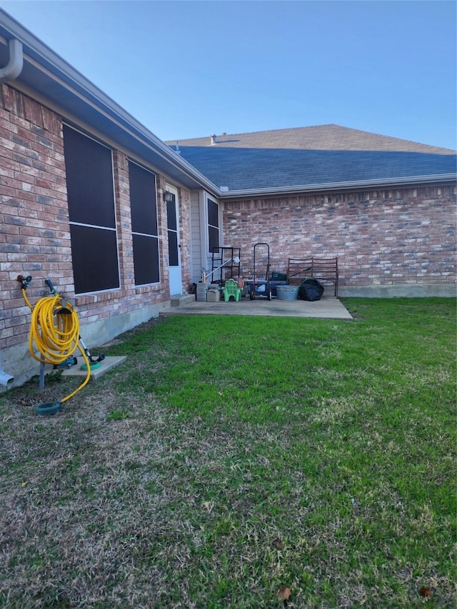 view of yard with a patio area