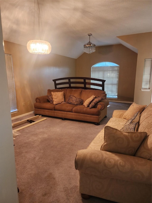 living room featuring an inviting chandelier, carpet flooring, and lofted ceiling