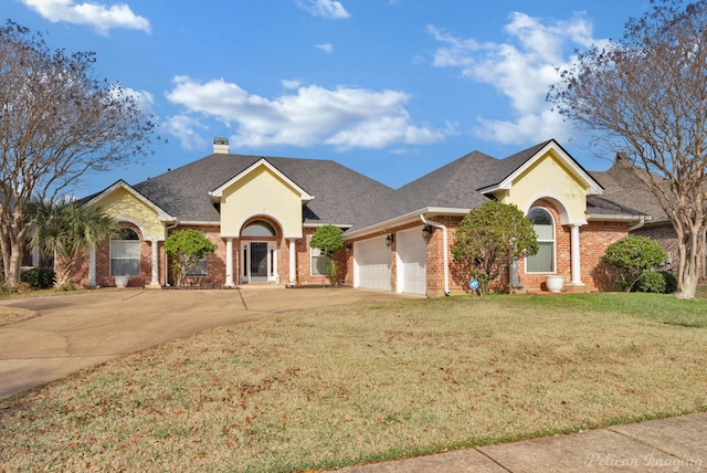 single story home featuring a front lawn and a garage