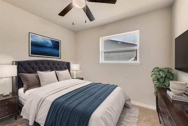 bedroom featuring ceiling fan and light colored carpet